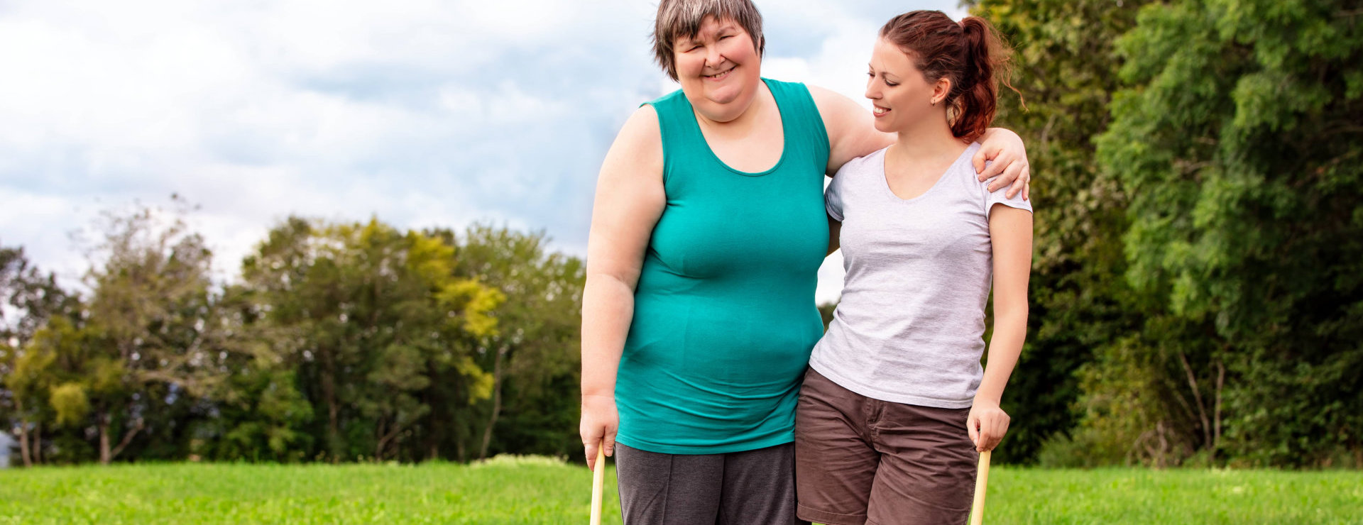caregiver and senior woman smiling